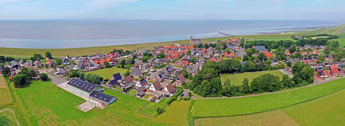 Aerial panorama from the traditional village Wierum at the Wadden Sea in Friesland the Netherlands