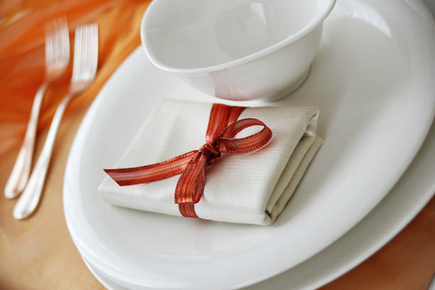 istock Table set in orange organza for a wedding banquet 1411838535