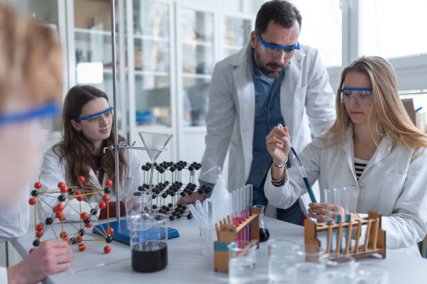 istock Science students with teacher doing chemical reaction experiment in the laboratory at university. 1411838570