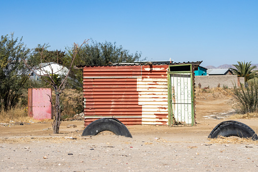 Shack at Katutura Township near Windhoek at Khomas Region, Namibia, with tyre manufacturer names visible.