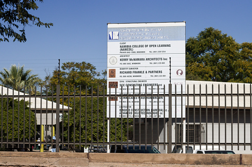 Namibia College of Open Learning in Windhoek at Khomas Region, Namibia, with other businesses and people visible.