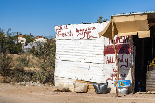 Kiosk at Katutura Township near Windhoek at Khomas Region, Namibia, with commercial signs visible.