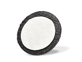 Half of chocolate cookies and cream isolated on white