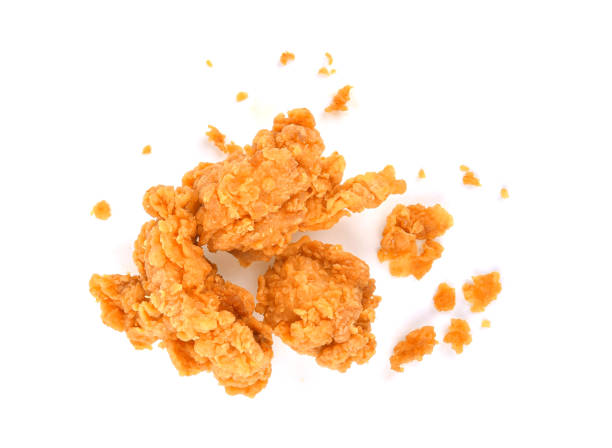 istock Fried popcorn chicken with crumbs isolated on white 1411839963