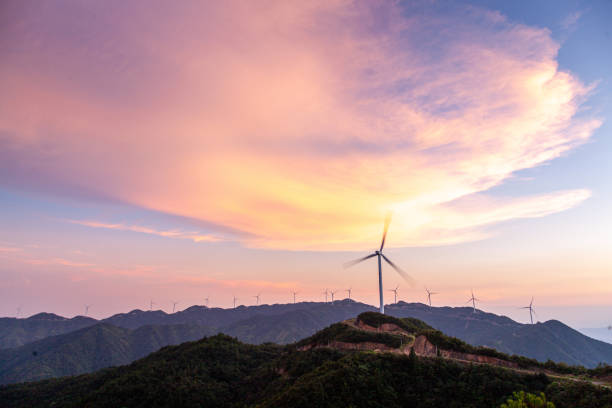 istock Wind farm  at sunset. Renewable energy concept. 1411840264