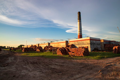 Factory chimneys on a blue sky