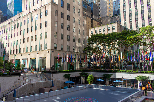 New York City, New York, USA - July 19, 2022: Daytime cityscape view of the winter ice skating rink at Rockefeller Center in Manhattan, New York City. In summer, it is called the Roller Boogie Palace.