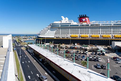 Cape Canaveral, Fl, USA -  January, 15, 2022: A Disney Cruise ship at Port Canaveral terminal in Fl, USA. Disney Cruise Line is a cruise line operation that is a subsidiary of The Walt Disney Company.