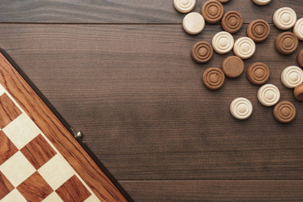 istock wooden draughts game 1411849579