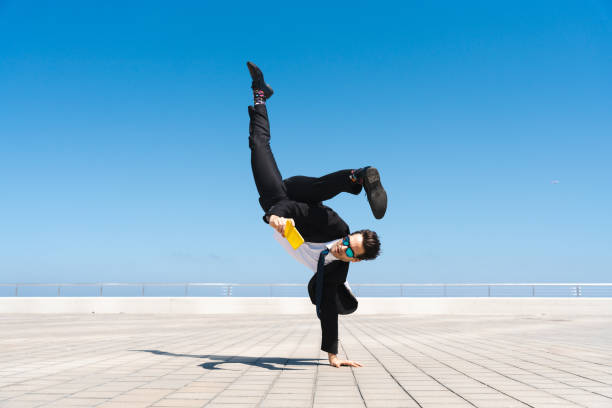 istock Flexible and cool businessman doing acrobatic trick 1411852592