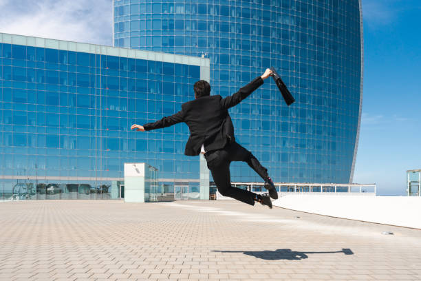 istock Flexible and cool businessman doing acrobatic trick 1411852694