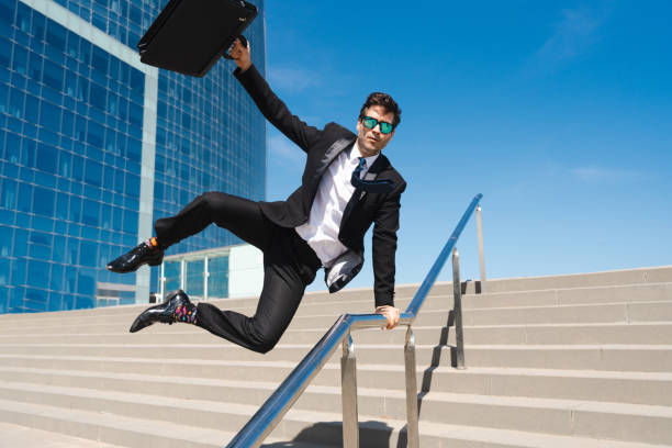 istock Flexible and cool businessman doing acrobatic trick 1411852743