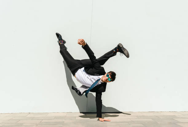 istock Flexible and cool businessman doing acrobatic trick 1411852829