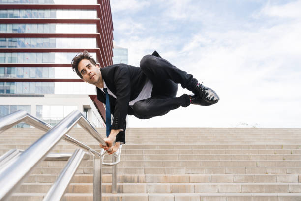 istock Flexible and cool businessman doing acrobatic trick 1411853396