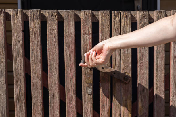 female hand opens the bolt on the tile. High quality photo