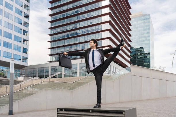 istock Flexible and cool businessman doing acrobatic trick 1411853727