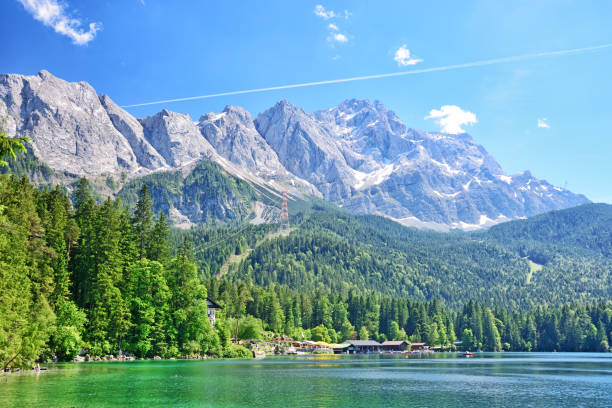 Eibsee Lake and Zugspitze mountain View of the lake Eibsee with the Zugspitze mountain on background, Germany zugspitze mountain stock pictures, royalty-free photos & images