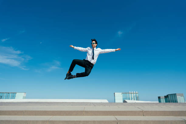 istock Flexible and cool businessman doing acrobatic trick 1411853812