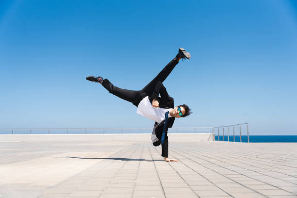 istock Flexible and cool businessman doing acrobatic trick 1411853995