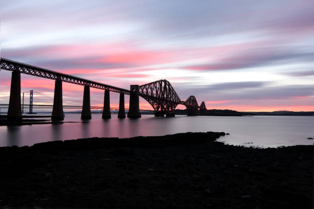 istock Forth Rail Bridge Queensferry Scotland against fed sky at sunset over River Forth 1411856227