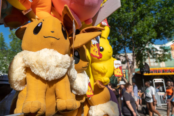 Calgary, Alberta, Canada - July 16, 2022: A Eevee pokemon stuffed plush toy offered as a prize for winning a carnival game