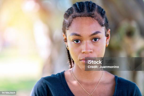 Serious Afrolatinx Young Woman Looking At The Camera Stock Photo - Download Image Now