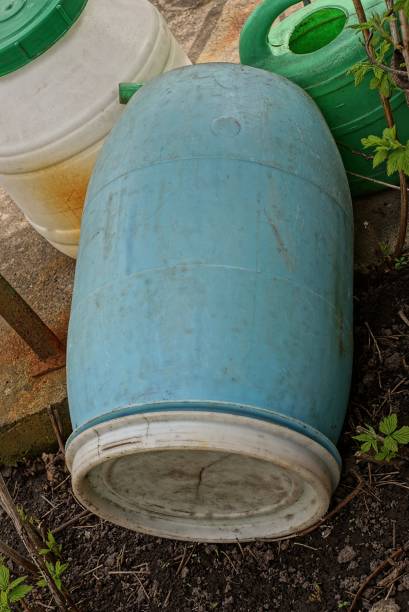 istock one blue dirty old plastic barrel closed with a white lid 1411862800