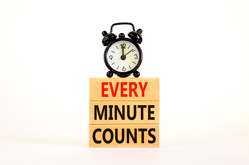 Every minute counts symbol. Concept words Every minute counts on wooden blocks on a beautiful white table white background. Black alarm clock. Business, motivational and every minute counts concept.