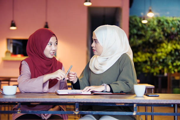 Sisters auditing the sale records and brainstorming new business ideas