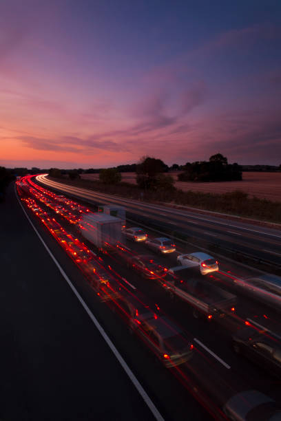 Slow moving traffic on M25 motorway at night, London, England, United Kingdom, Europe stock photo