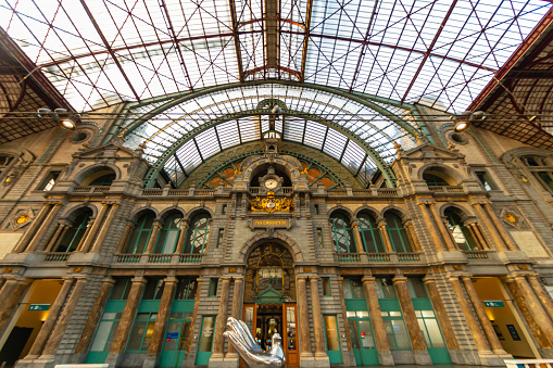 Snapshot at Antwerp Central Station in Belgium, on a quiet Saturday evening. The city is the capital of Antwerp Province in the Flemish Region. Note the aesthetics and cleanliness, as well as the architectural beauty of the building. Photographed on July 23, 2022