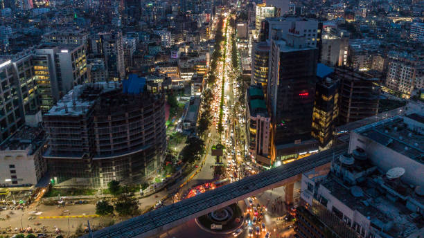 istock Dhaka Metro Rail Line 6 and under-construction skyscraper surrounded - Stock Image 1411872515