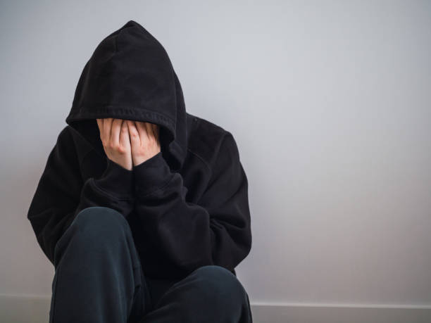 istock Unrecognizable man covering his face with his hands crying with copy space. concept psychological problems 1411877975