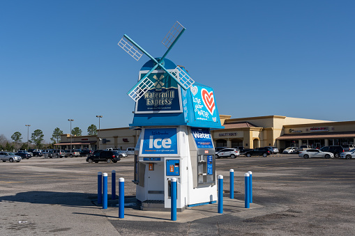 Pearland, TX, USA - March 10, 2022: A Watermill Express refill kiosk in Pearland, TX, USA. Watermill Express is an American supplier for refill kiosks that provide drinking water and ice.