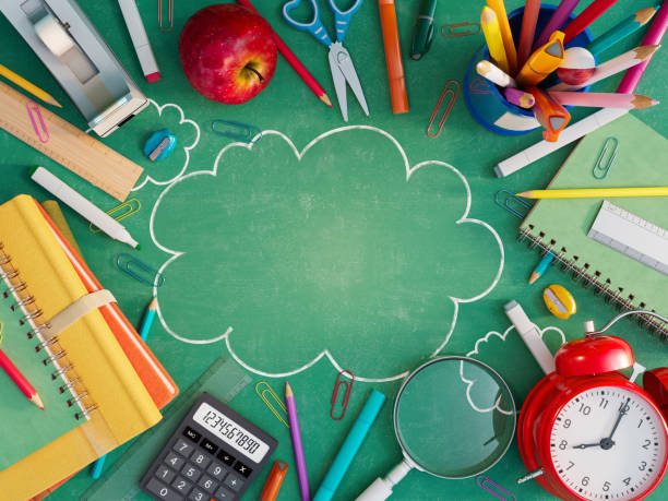 istock School stuff with copy space on green blackboard. Back to school concept background 1411880865