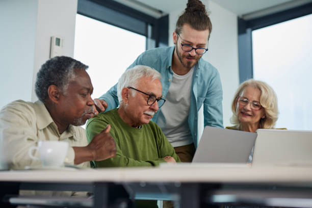 istock A group of senior students sit in a classroom with their teacher and work on a school project. 1411881869