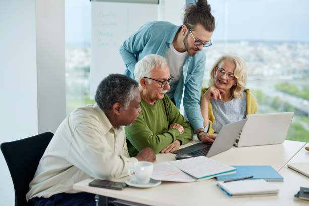 istock A group of senior students sit in a classroom with their teacher and work on a school project. 1411881895