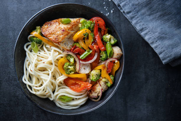 istock Noodles with vegetables in bowl 1411881975