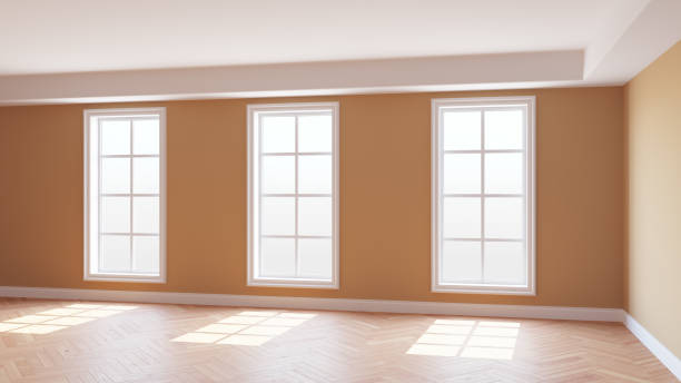 istock Sunny Interior Concept with Beige Walls, Three Large Windows 1411881991