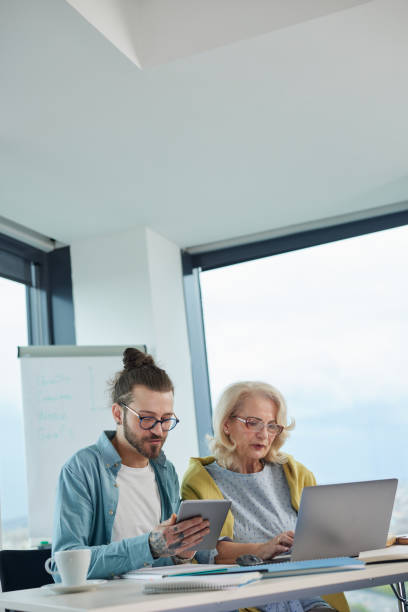 istock An educator helping female senior student to master the material. 1411882159