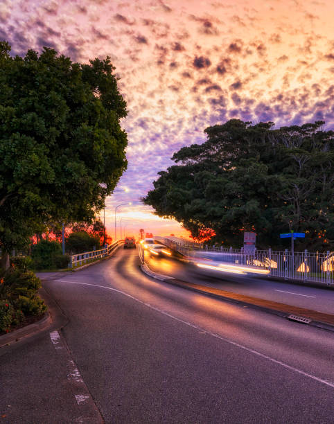 Entrance to Head Street bridge across Wallis lake between Forster and Tuncurry towns on Pacific coast of Australia at sunset.