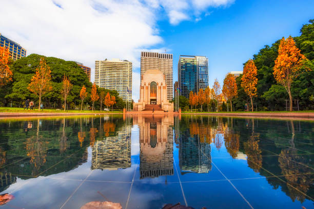 Syd Hyde Park Pond memor low pool Still calm water pool in Hyde park of Sydney city CBD reflecting high-rise towers, trees and war memorial. hyde park sydney stock pictures, royalty-free photos & images