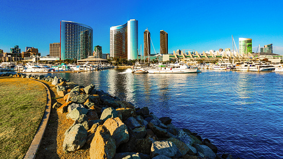 San Diego, California, 04/12/2019 - Marina Sunset at San Diego, California, with yachts and hotel buildings on the background