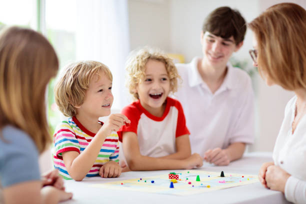 istock Family playing board game. Kids play. 1411895206