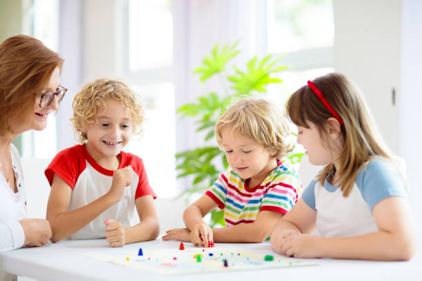 istock Family playing board game. Kids play. 1411895227