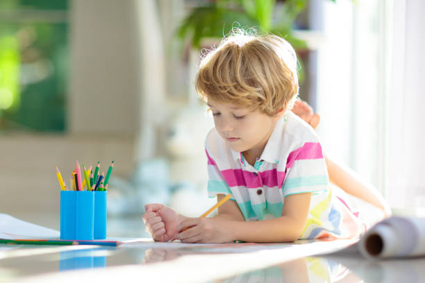 istock Child drawing. Kid painting rainbow. 1411895338