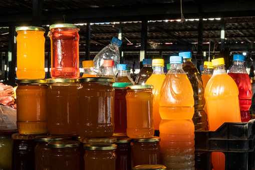 Sarande, Albania Jars of honey for sale in the market.