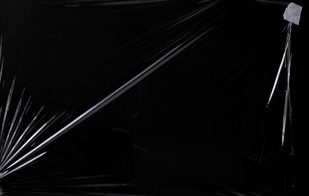 istock Black transparent plastic wrap texture overlay background. Realistic plastic for poster design and photo overlay effect. Wrinkled plastic surface pattern for graphic design sources and element. 1411917136