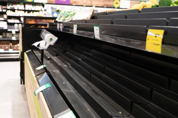 istock Empty shelves of vegetables in a supermarket 1411920792