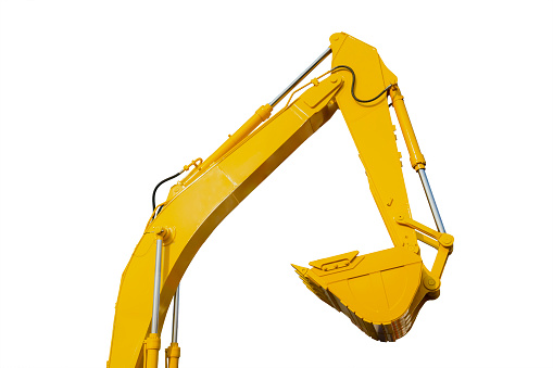 Close up of yellow excavator bucket in the studio. Isolated on white background
